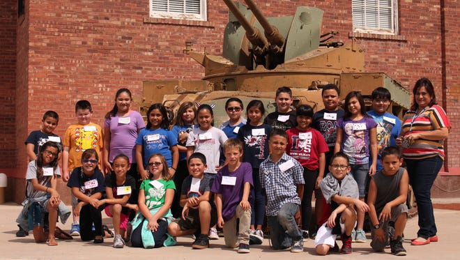 Fourth graders in Mary Ortiz's fourth-grade class at Chaparral Elementary School enjoyed a visit to the Deming-Luna-Mimbres Museum on Monday at 301 S. Silver Avenue. During the field trip, students learned about the history of the Mogollon culture native to the Mimbres region and also dug deeper into the history of Deming and Luna County. The students took time out from their educational visit to be photographed in from of an artillery tank at Veterans' Park, next to the museum.