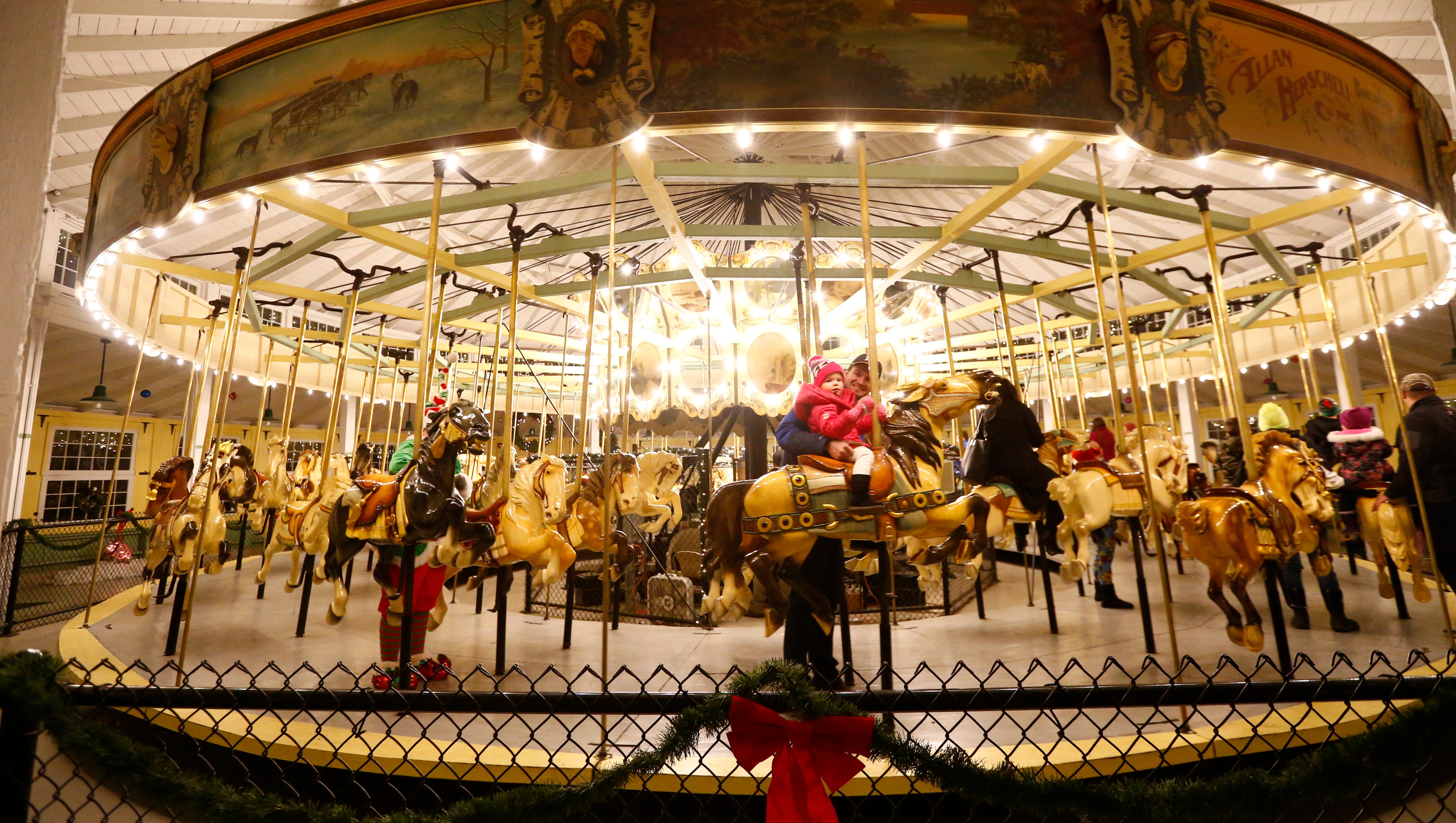 Johnson City Carousel decorated for the holidays and visists with Santa
