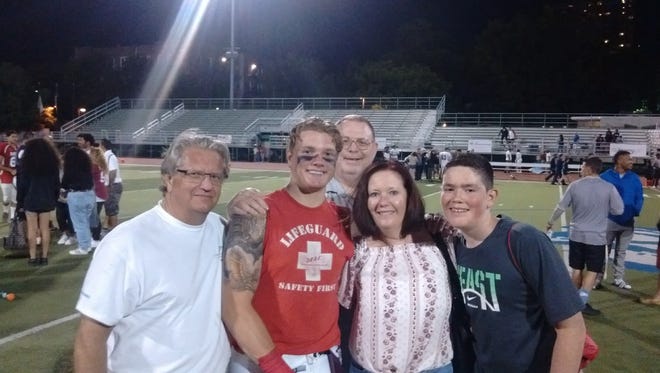 Nutley's Hunter Lechthaler (second from left) with his family after the Robeson game.