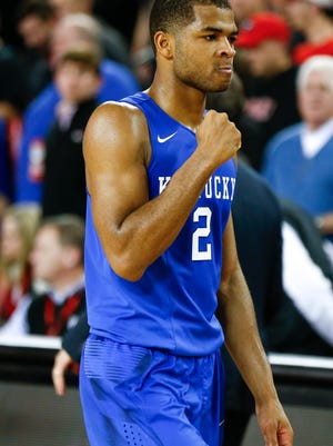 Kentucky guard Aaron Harrison (2) pumps his fist as he leaves the court after in the second half of an NCAA college basketball game against georgiaTuesday, March 3, 2015, in Athens, Ga. Kentucky won 72-64 and improved their record to 30-0. (AP Photo/John Bazemore) 
