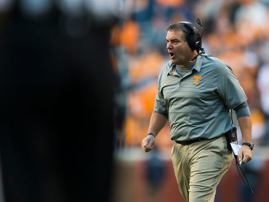 Tennessee Interim Head Coach Brady Hoke yells to players