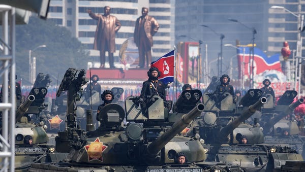 Korean People's Army tanks take part in a...