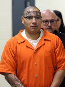 Alexander Salgado is escorted into Minnehaha Court on Wednesday to testify in Maricela Diaz's trial for the 2009 murder of Jasmine Guevara.
