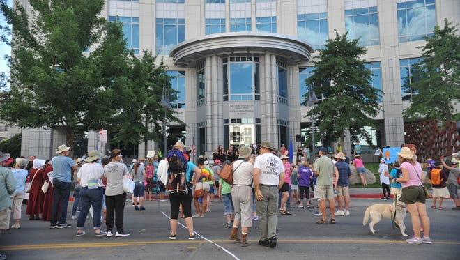 People gathered for a rally at the Federal Courthouse in downtown Reno Saturday, July 29, 2017.