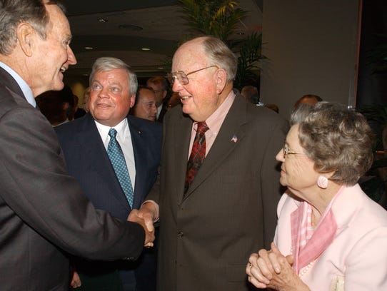 Former president George Bush is introduced to Red Dumesnil and his wife Gertrude by Richard Zuschlag during a reception Friday, April 28, 2006.