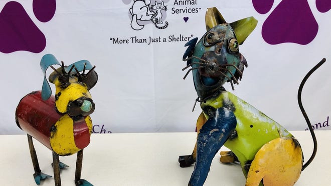 Dog and cat metal garden statues donated for the 2020 Second Chance auction.