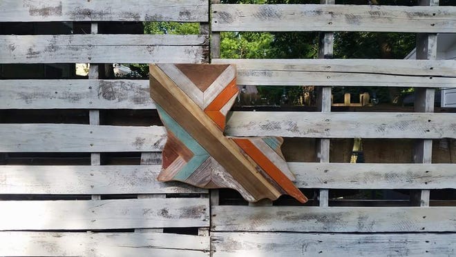 Joshua Mitchell used reclaimed wood to create Louisiana artwork.