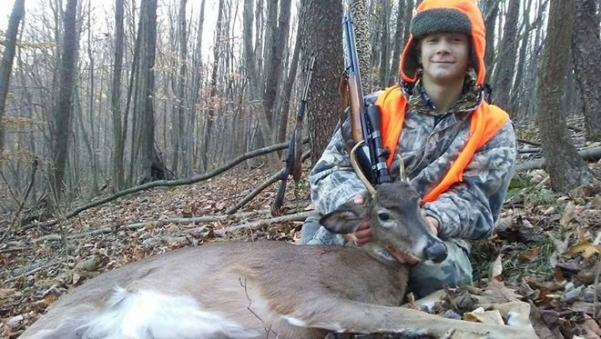 Marshall Jackson, 13, from Dover Township shows off this buck he shot in Adams County. It's the sixth deer he's harvested since he began hunting and his fourth buck.