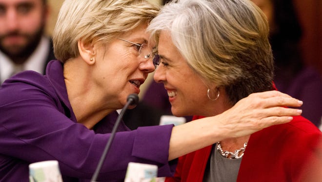 Senate Health, Education, Labor and Pensions Committee member Sen. Elizabeth Warren, D-Mass., left, talks with House Education and the Workforce Committee member Rep. Katherine Clark, D-Mass., on Capitol Hill in Washington, Wednesday, Nov. 18, 2015,as House and Senate negotiators try to resolve competing versions of a rewrite to the No Child Left Behind education law.