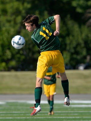 CMR's Blake Sowers leaps for the ball during in a game earlier this season. The junior booted four goals in a 5-3 win over Butte as the Rustlers clinched a state tournament berth.