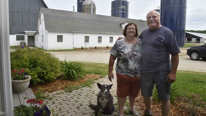 Debbie and Ed Staats with their border collie Molly on their farm north of Sturgeon Bay at 5706 N. Country View Road. The Staats will be hosting the 37th annual Dairy Breakfast on Sunday, July 1, sponsored by the Sevastopol FFA Alumni Association.