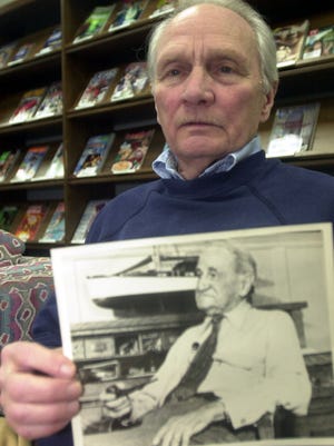 Bob Reynolds, shown here at the Ida Rupp Library in Port Clinton with a picture of his grandfather, Scott J. Matthews, will be showing a video on the boat company founder's 1906 trip along the "Great Loop" Sunday at the Rutherford B. Hayes Presidential Library and Museums.