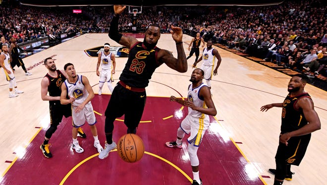 Cleveland Cavaliers forward LeBron James (23) dunks the ball against the Golden State Warriors in Game 3 of the NBA Finals.