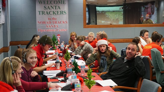 Volunteers on the NORAD Tracks Santa line handle about 4,000 calls every 30 minutes on Christmas Eve.