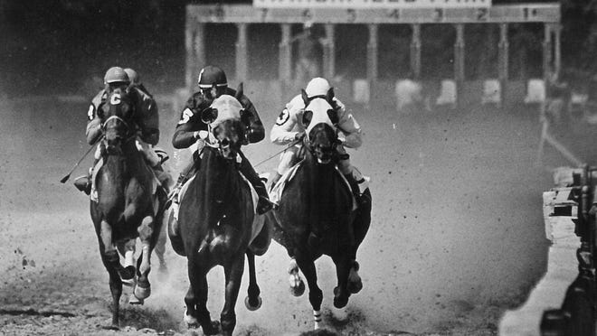 Horses zip down the home stretch at Marshfield Fair in 1983.