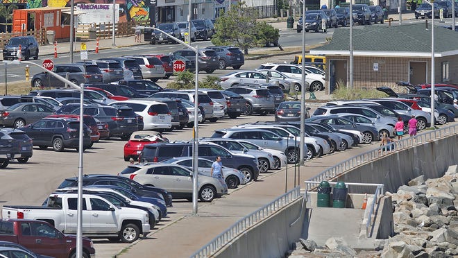 The DCR parking lot on Nantasket Beach. Hull which some town officials would like to cut capacity in half.  Wednesday August 12, 2020 Greg Derr/The Patriot Ledger