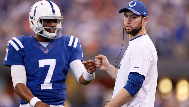 Indianapolis Colts quarterback Andrew Luck (12) and Jacoby Brissett (7) during a timeout in the first half of their game at Lucas Oil Stadium, Oct 8, 2017. The Indianapolis Colts defeated the San Francisco 49ers 26-23 in overtime.