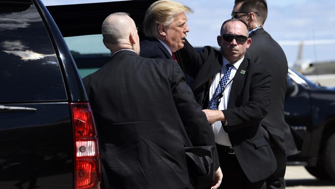 President Donald Trump gets out of his vehicle as he heads to board Air Force One at Andrews Air Force Base, Md., Monday, April 15, 2019. Trump is heading to Minnesota for an event on tax day.
