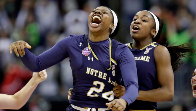 Notre Dame's Arike Ogunbowale is congratulated by teammate Jackie Young after beating Mississippi State, 61-58, for the NCAA championship.