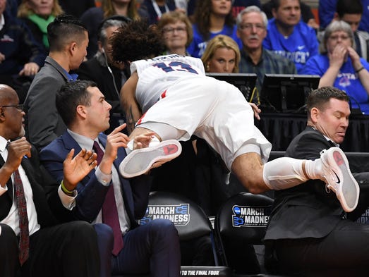 Gonzaga Bulldogs guard Josh Perkins (13) collides with