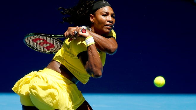 Serena Williams hits a backhand return to Hsieh Su-Wei during their second round match Wednesday at the Australian Open tennis championships in Melbourne, Australia.