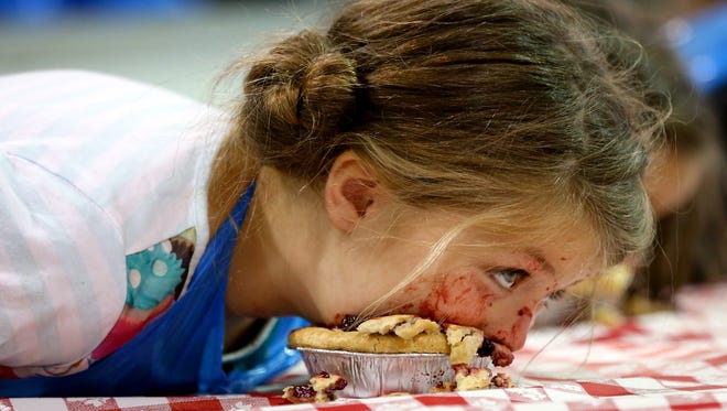 Kyhara Waldon, 6, during the 2nd annual Willamette Valley Pie Company's pie eating contest during 150th Oregon State Fair, Thursday, September 3, 2015, in Salem, Ore.