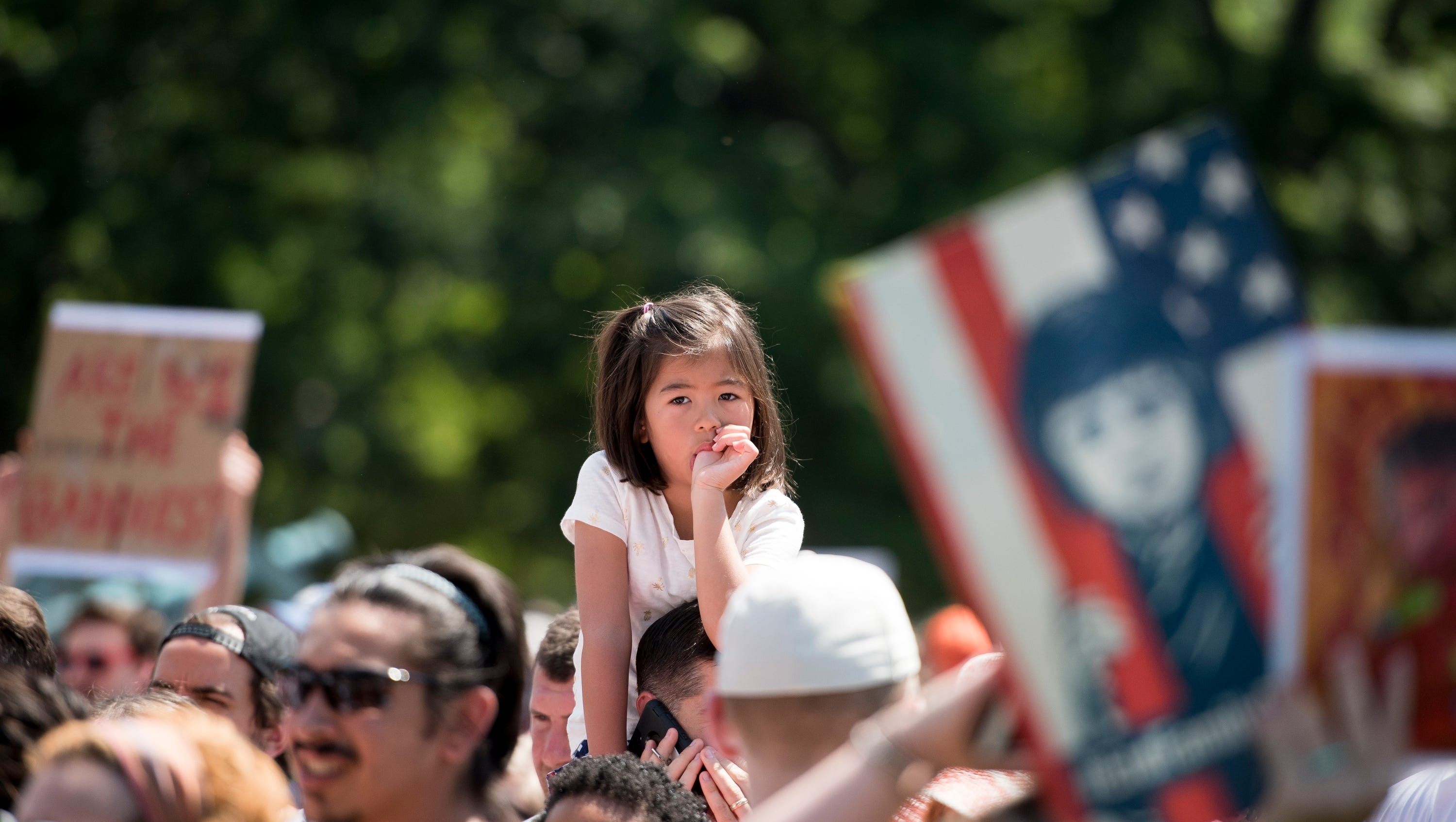 People gather for the Families Belong Together rally