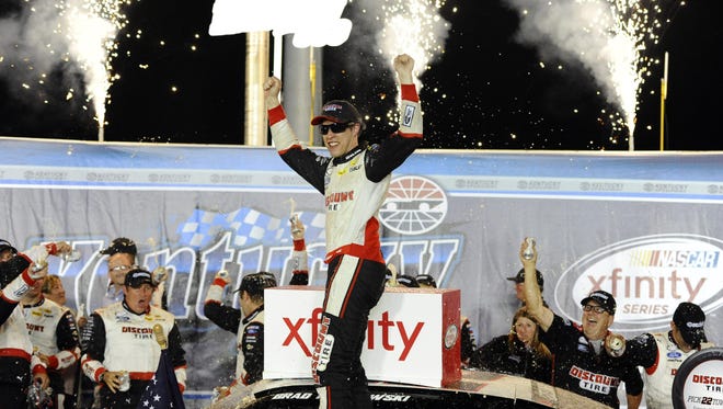 Brad Keselowski celebrates after winning the Xfinity July Kentucky Race at Kentucky Speedway Friday.