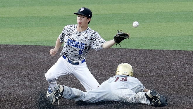 The ball skips past Horseheads second baseman Zac Scibek as Austin Zakow of Arlington slides into second base Thursday during a Class AA regional game at Maine-Endwell.