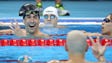 Michael Phelps reacts with Laszlo Cseh of Hungary after
