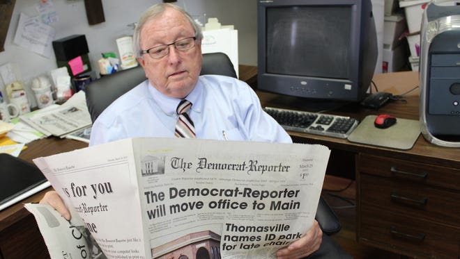 Publisher Goodloe Sutton of The Democrat-Reporter, a weekly newspaper in  Linden, Ala., reviews an article about the paper moving to a new location.