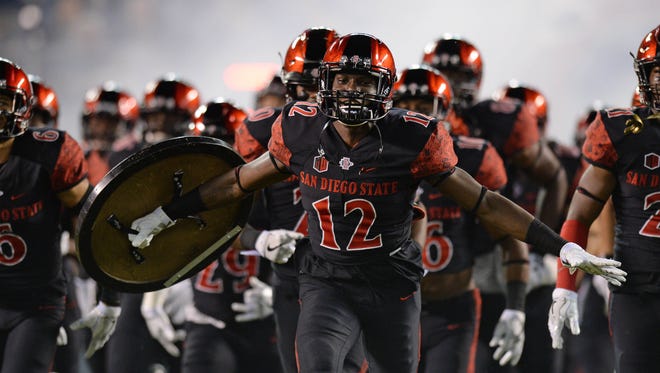 San Diego State safety Malik Smith leads the team out on the field before the Aztecs' game against Cal.