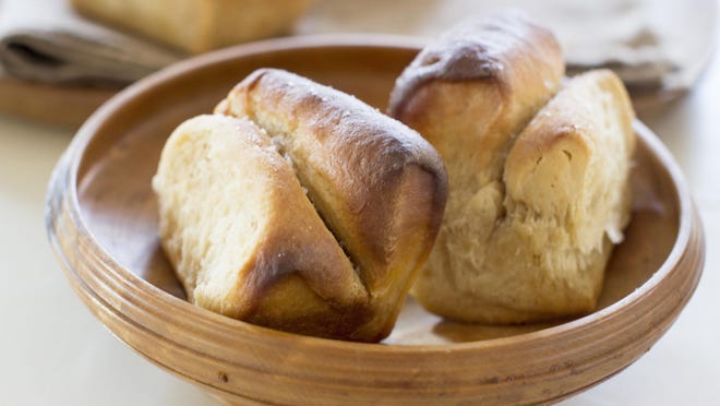 These easy-to-make dinner rolls are inspired by buttery parkerhouse rolls but are spiced and sweetened with a bit of fresh apple cider that has been boiled down to a syrup.