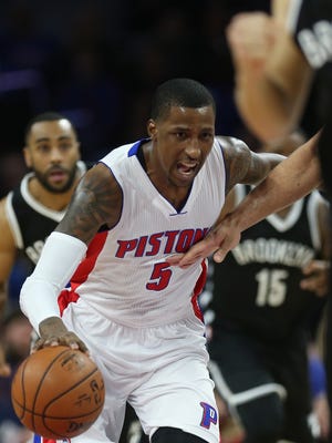 Pistons guard Kentavious Caldwell-Pope drives against Nets guard Markel Brown during the first period on Saturday at the Palace.