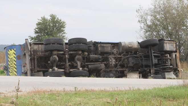 A garbage truck was on its side after an accident on U.S. Highway 6 just east of P Avenue Thursday, Oct. 6.