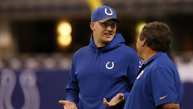Indianapolis Colts quarterback Matt Hasselbeck (8) talks with Colts quarterback coach Clyde Christensen before the Tennessee Titans at Lucas Oil Stadium on Jan. 3, 2016.