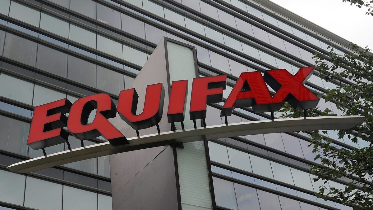 File photo taken in 2012 shows a corporate sign at the headquarters of Equifax in Atlanta, Ga.