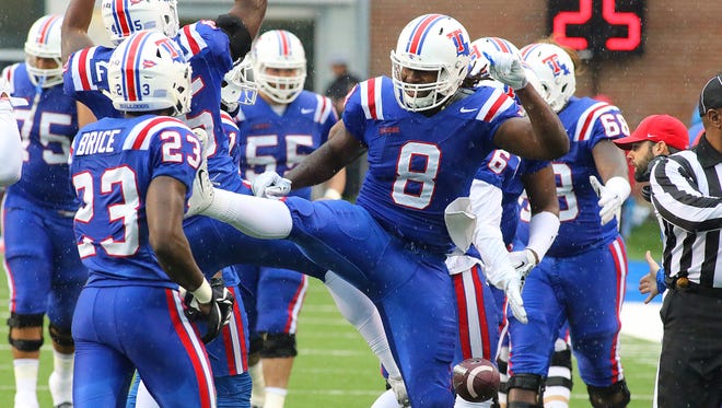 Louisiana Tech's defense celebrates after a play Saturday against North Texas. The Bulldogs won 56-13.
