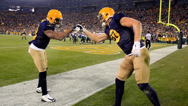 Green Bay Packers receivers Jordy Nelson and Randall Cobb celebrate a Packers touchdown.