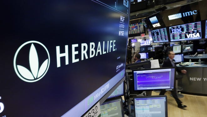 Herbalife will remain in business but must change the way it operates, according to a settlement the company reached with the Federal Trade Commission.