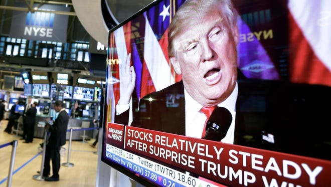 Trump Rally is born: An image of President-elect Donald Trump appears on a TV screen at the New York Stock Exchange on Nov. 9, 2016, the first trading day after his surprise Election Day win.
(AP Photo/Richard Drew)