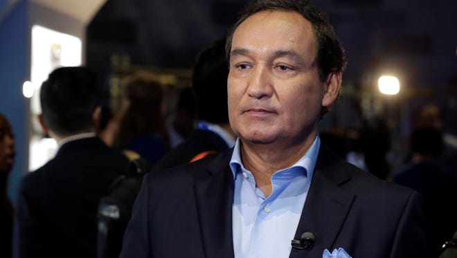 FILE - In this Thursday, June 2, 2016, file photo, United Airlines CEO Oscar Munoz waits to be interviewed, in New York, during a presentation of the carrier's new Polaris service, a new business class product that will become available on trans-Atlantic flights. Munoz said in a note to employees Tuesday, April 11, 2017, that he continues to be disturbed by the incident Sunday night in Chicago, where a passenger was forcibly removed from a United Express flight. Munoz said he was committed to “fix what’s broken so this never happens again.” (AP Photo/Richard Drew, File)