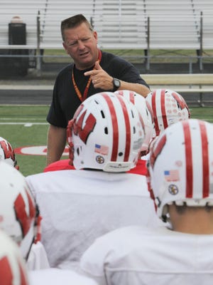 Enquirer file
Lakota West coach Larry Cox won his 100th game at the school when the Firebirds defeated Sycamore Oct. 10. He is in his 18th season as head coach there.
BN FIREBIRDS HOMETOWN   Coach Larry Cox  at a recent Lakota West Football team practice gives his team a prep talk in West Chester where the Firebird where tuning up for a Friday night game. September 18, 2013 The Enquirer/ Tony Jones