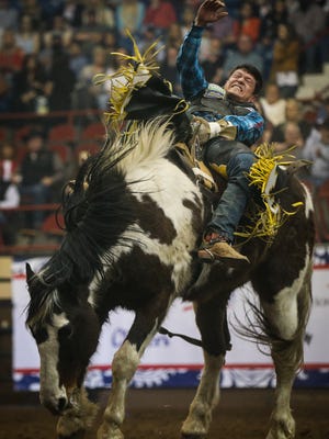 Tanner Aus rides in the bareback event during the 5th performance of the San Angelo Stock Show & Rodeo Friday, Feb. 10, 2017, at Foster Communications Coliseum. 