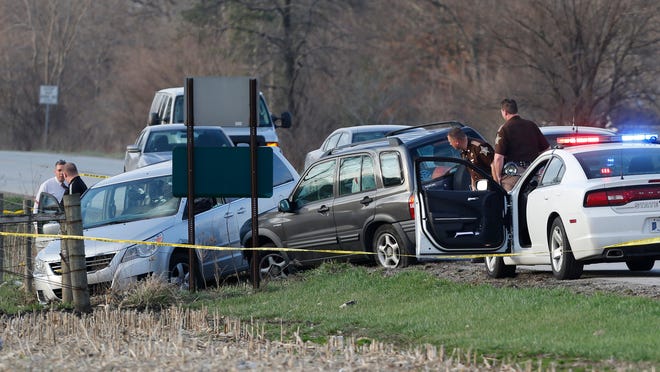 John Terhune/Journal & CourierLaw enforcement officers from several counties gather at the shooting scene Thursday on U.S. 421 about a half mile north of Monon. What began as a robbery in Watseka, Ill., turned into a multi-county chase in Indiana, ending with the armed robbery suspect being shot. Law enforcement officers from several counties gather at the scene of a police action shooting Thursday, April 9, 2015, on U.S. 421 about a half mile north of Monon. What began as a robbery in Watseka, Illinois, turned into a multi-county chase in Indiana, ending with the armed robbery suspect being shot after he fired at police. A hostage taken by the robbery suspect was transported to IU Health White Memorial Hospital with unknown injuries.