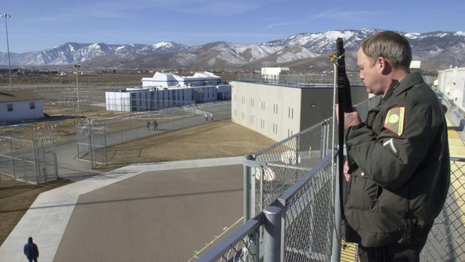 A corrections officer watches over the yard at Warm Springs Correctional Center near Carson City in this file photo.