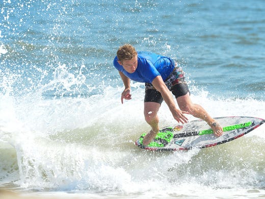 Sam Stinnett, Dana Point, Ca., catches a wave during