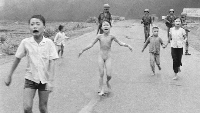 This Pulitzer Prize-winning 1972 photo of naked 9-year-old Kim Phuc and other terrified Vietnamese children fleeing from a napalm attack is one of the most memorable photos of the 20th century.
