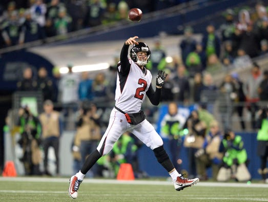 Falcons quarterback Matt Ryan throws on the run during