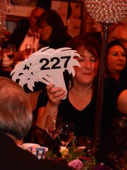 Cancer Society manager Sue Olszak with a table's worth